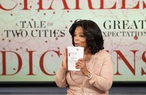 News cover "The Oprah Winfrey Show "  is on the head of newspapers